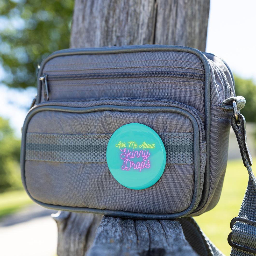 Partner.Co | Ask Me About Skinny Drops Neon Logo Turquioise | Button Pins
